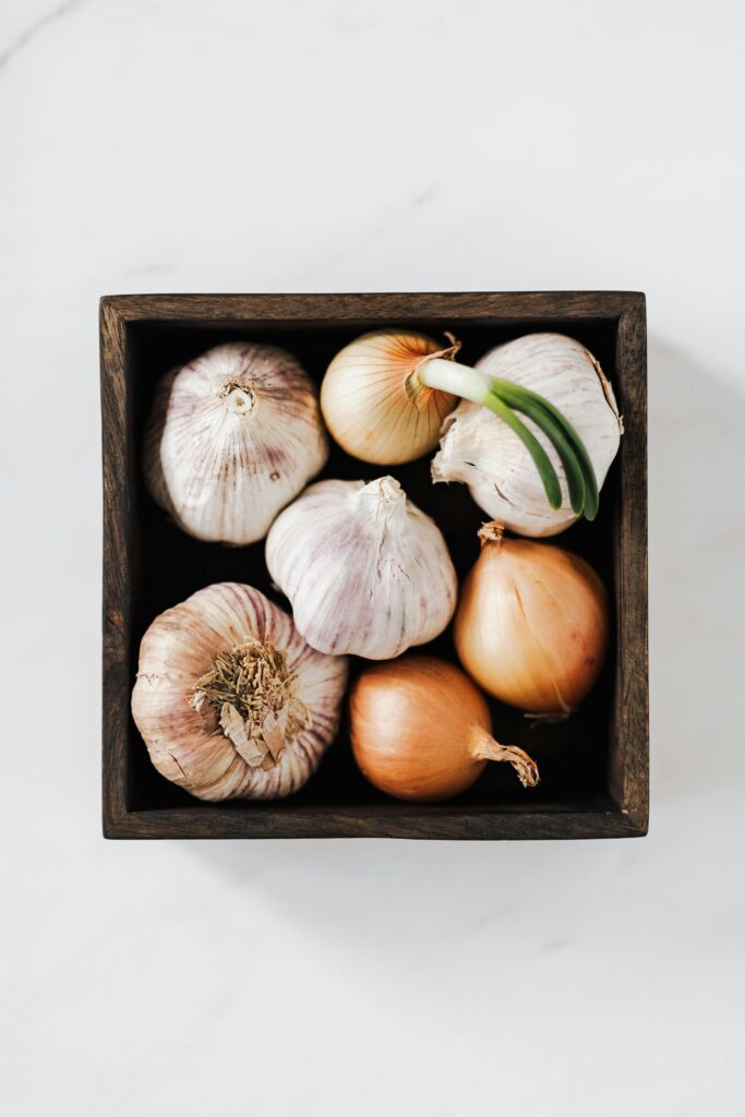 Shallot and garlic in a wooden box