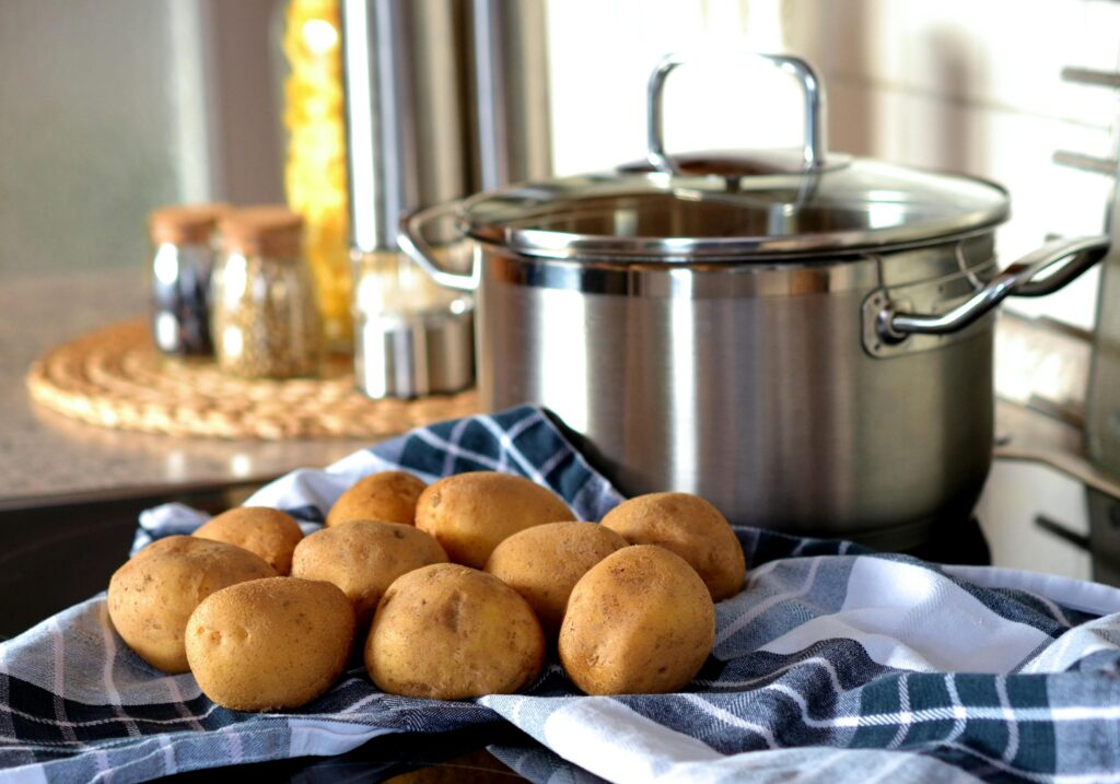 Yukon Golden potato a napkin and a stainless pot in the background