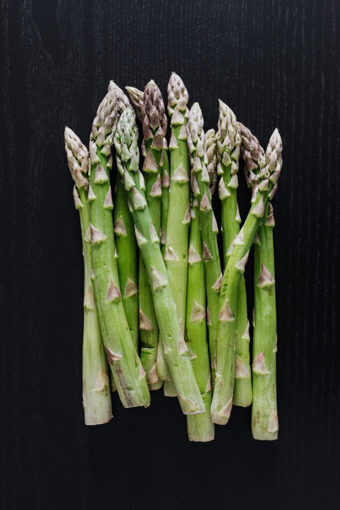 A handful of Asparagus with a Black Background