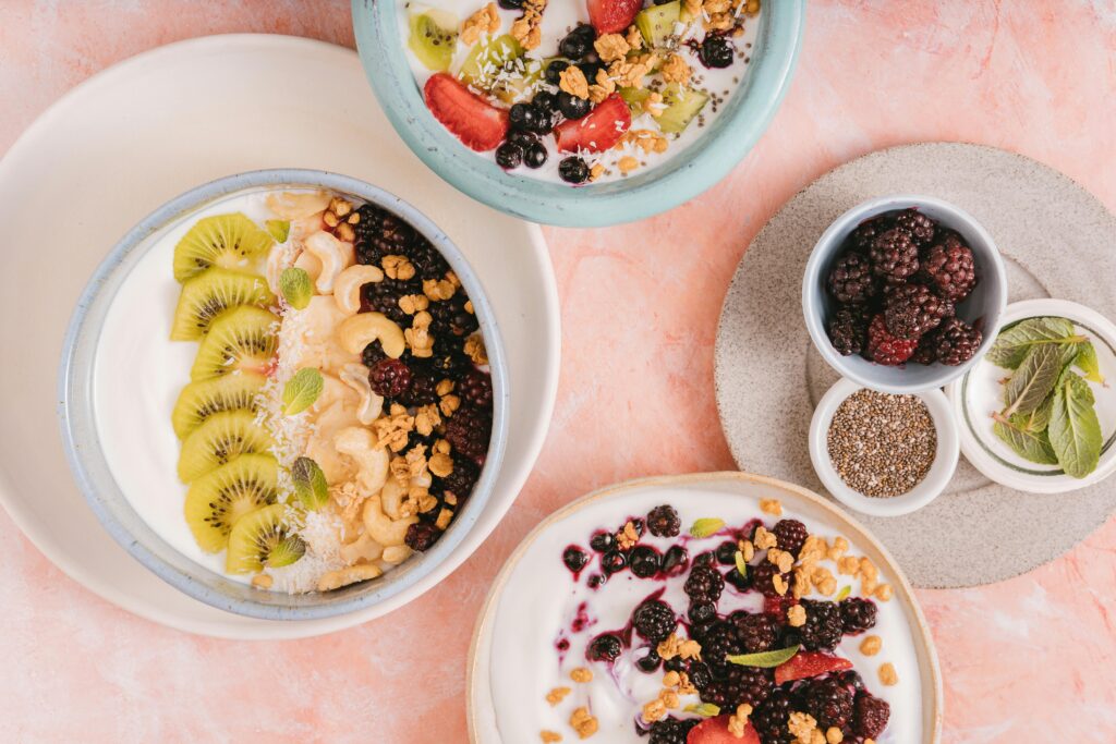 chia based breakfast garnished with berries and kiwi