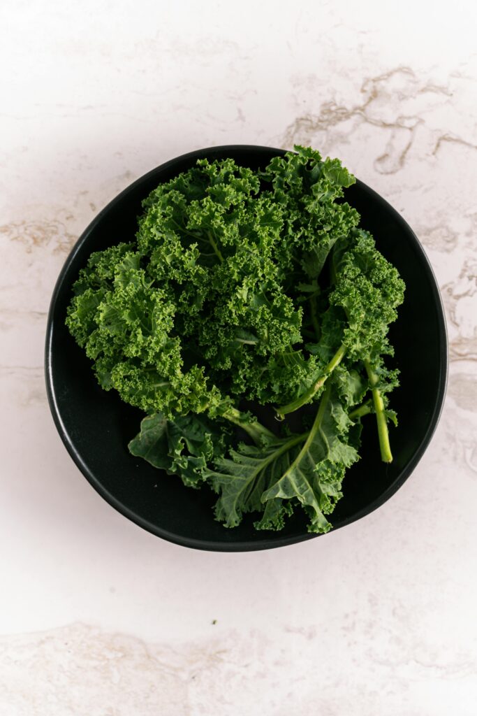 fresh green kale in a black plate