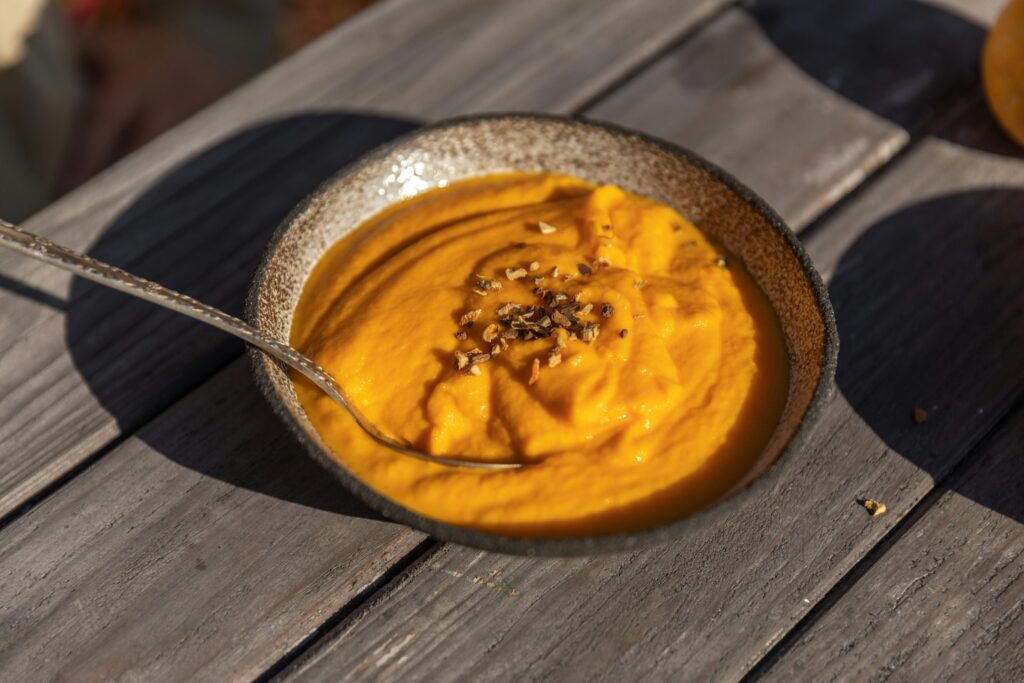 A Mixed Pumpkin in a Plate with a Spoon