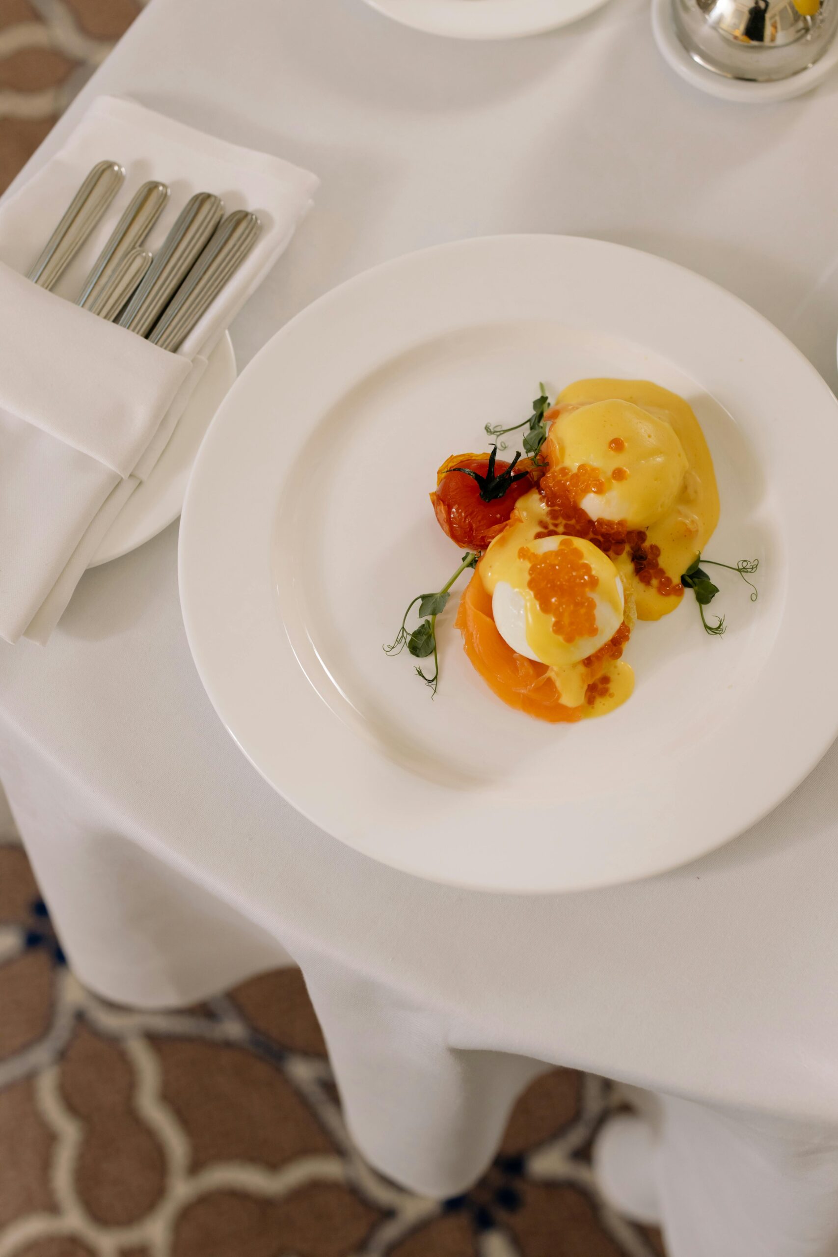 Poached Eggs with Caviar in a white plate