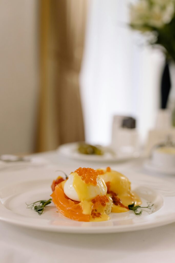 Poached eggs with Caviar in served in a white plate