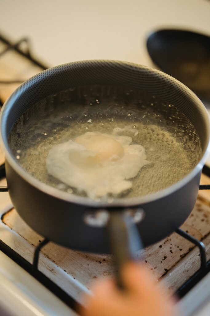 Poaching Eggs in a Pan Full of Simmered Water