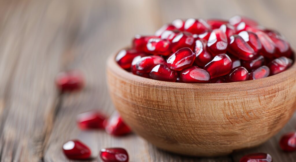 pomegranate Seeds in Wooden Bowl 