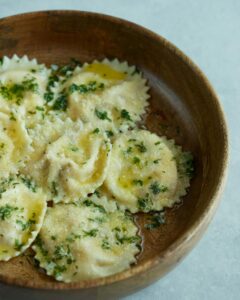 Pumpkin Ravioli in a Wooden Plate