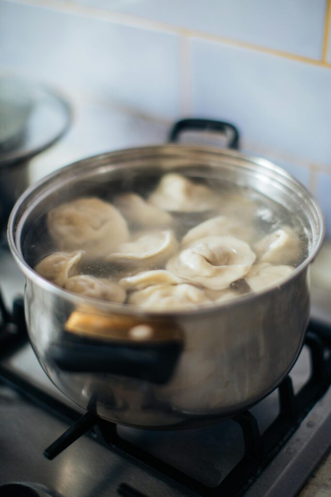 Pumpkin Ravioli boiling In a Pot