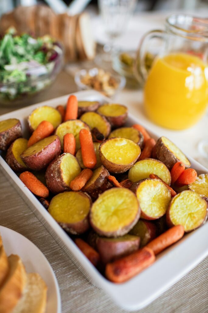 Roasted Sweet Ptatoes And Carrot With a Jar Of Fresh Orange Juice