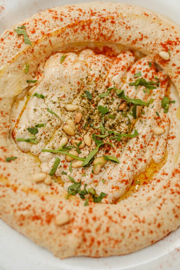 Tahini Garlic Garnished with Herbs And Olive Oil