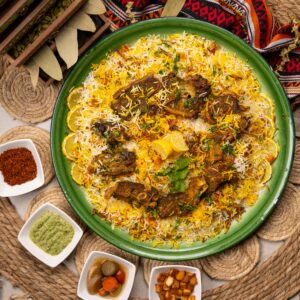 lamb biryani in a green plate