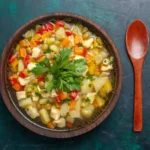 Bowl of Hearty Cabbage and Vegetable Soup with Fresh Parsley