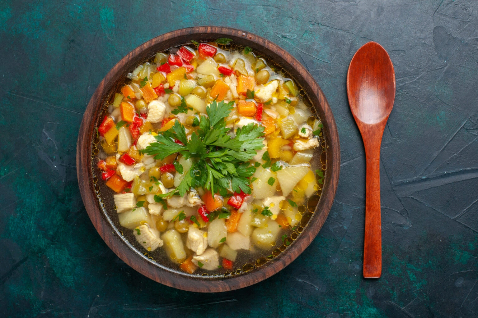 Bowl of Hearty Cabbage and Vegetable Soup with Fresh Parsley