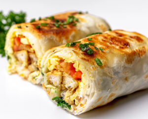 a close up of a breakfast burrito