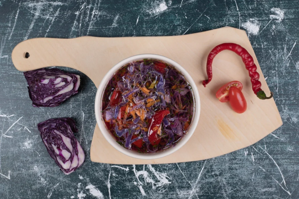  Bowl of Colorful Cabbage and Vegetable Soup with Red Chili and Fresh Ingredients