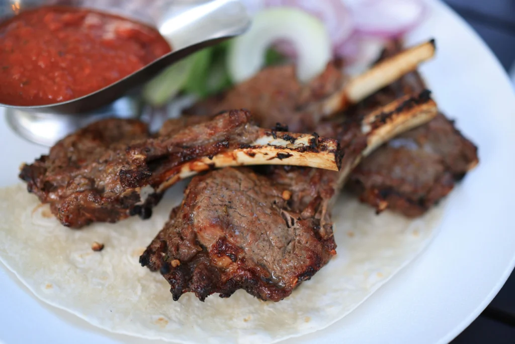 Grilled Lamb Chop on a White Plate 