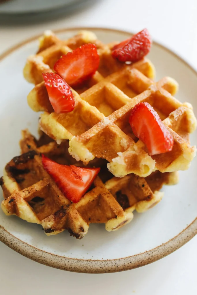 classic waffles garnished with strawberries